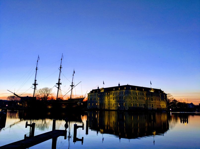 Sunset over Amsterdam's harbour and tall ship